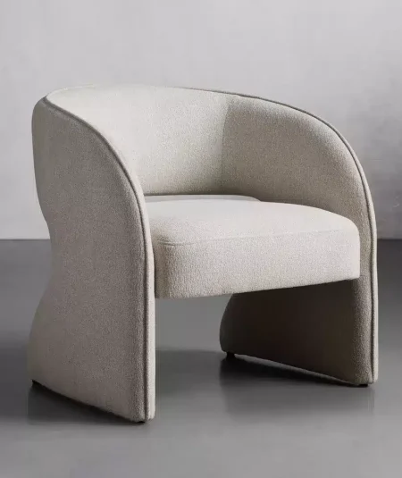 a white chair with curved legs