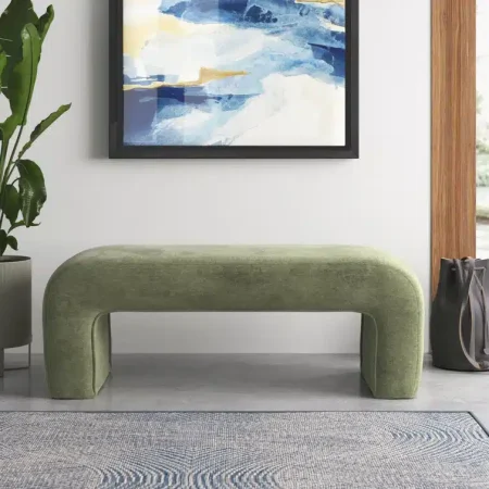 This upholstered bench features waterfall edges that create a striking shape for a streamlined