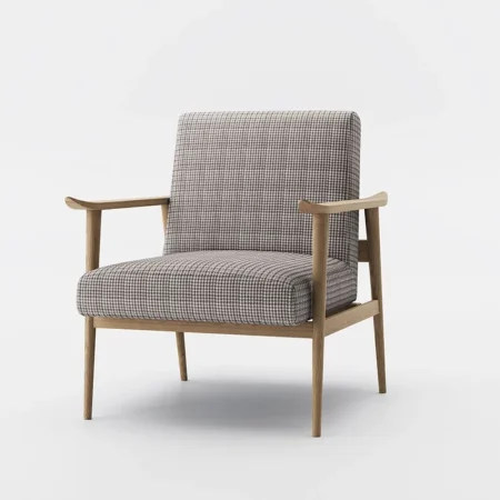 Mid-century modern armchair with checkered brown and beige upholstery, angled wooden legs, and natural wood armrests, placed on a patterned rug over hardwood flooring.