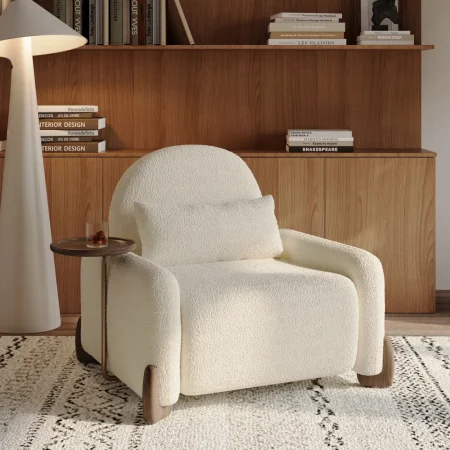 Modern cream fabric sofa chair with curved arms, matching cushion, and attached wooden side tray