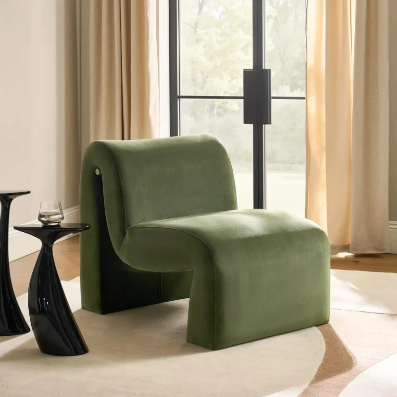 Riva Chair with sculptural curved form and dark green upholstery for modern interiors