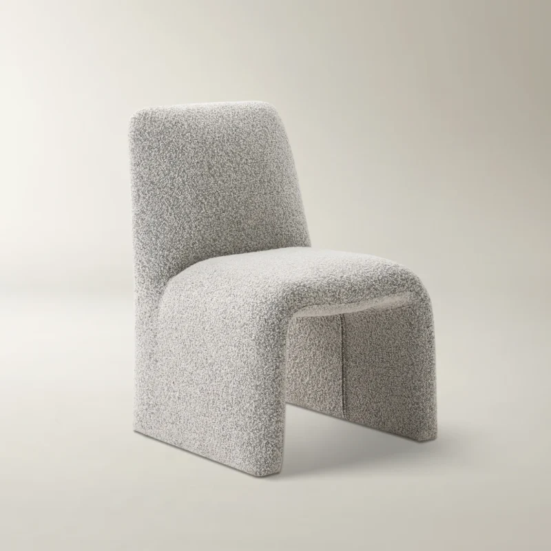 Mono Loop Chair with boucle upholstery and sculptural arch base for modern interiors